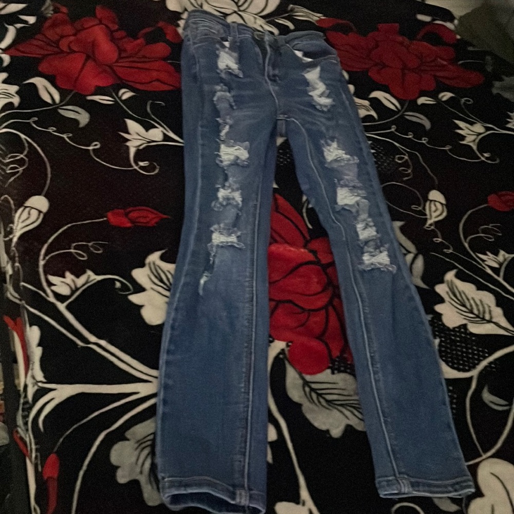 Blue ripped jeans.